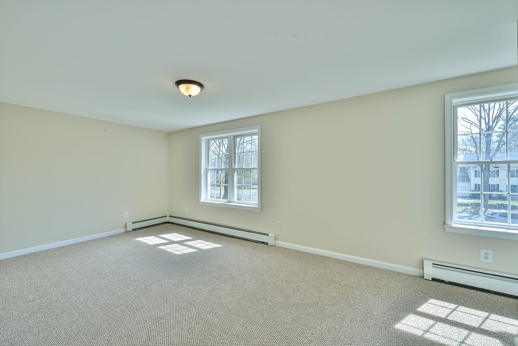 99 Smith Road Charlton, MA 01507 - Photo 36 of 37 an empty room with windows