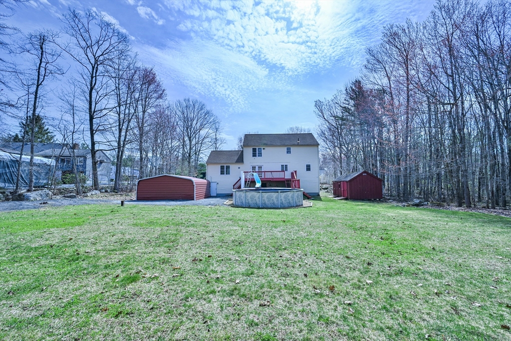 99 Smith Road Charlton, MA 01507 - Photo 9 of 37 a backyard of a house with table and chairs