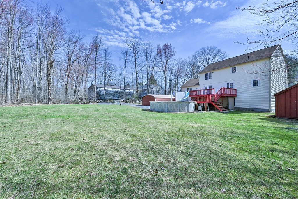 99 Smith Road Charlton, MA 01507 - Photo 10 of 37 a view of a house with backyard and sitting area
