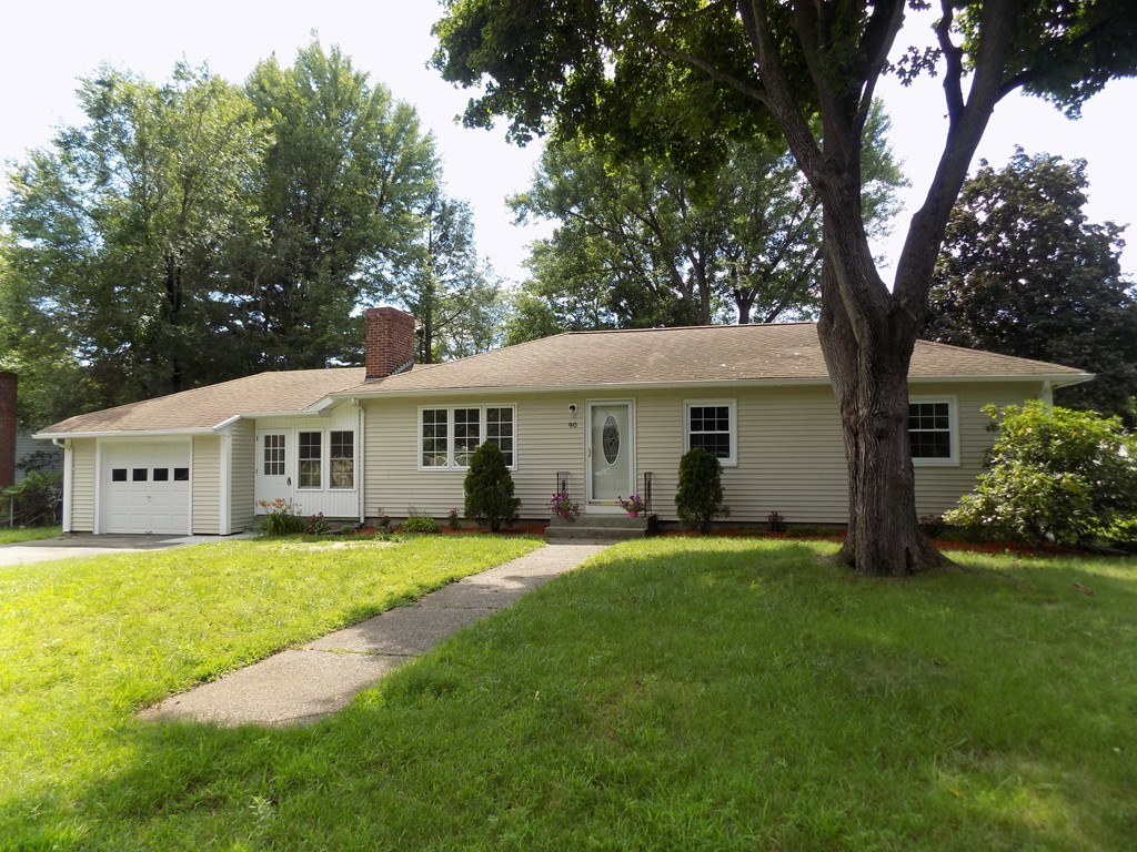 90 Embassy Road Springfield, MA 01119 - Photo 18 of 18 a front view of a house with a yard and trees