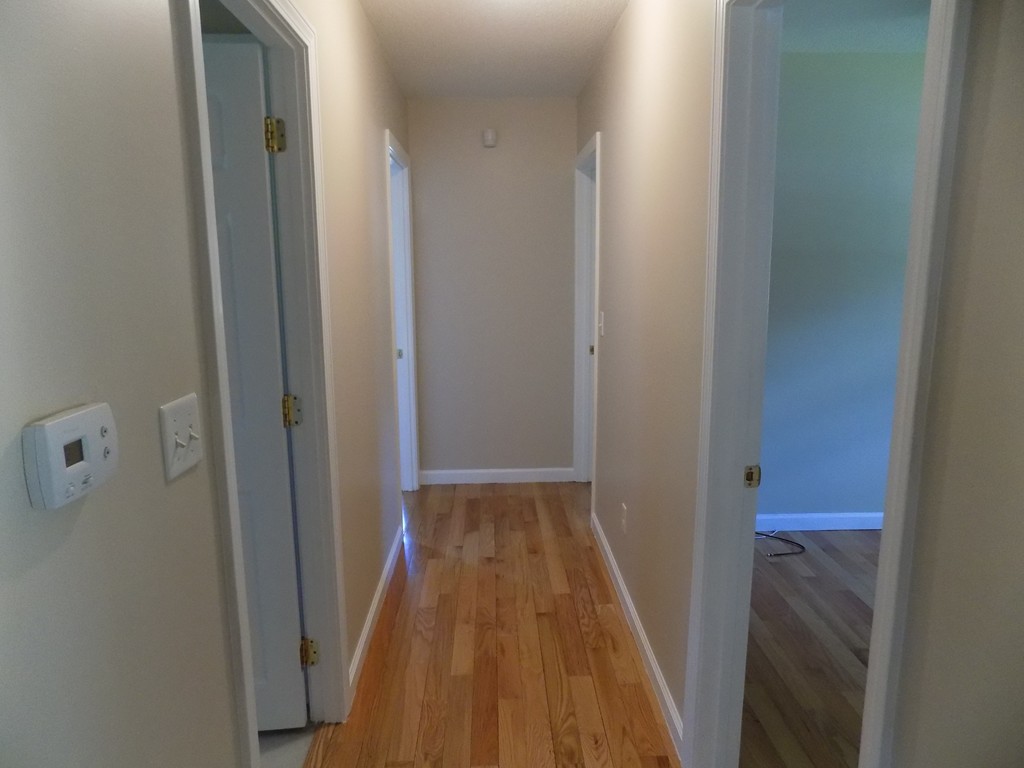 90 Embassy Road Springfield, MA 01119 - Photo 8 of 18 a view of hallway with wooden floor