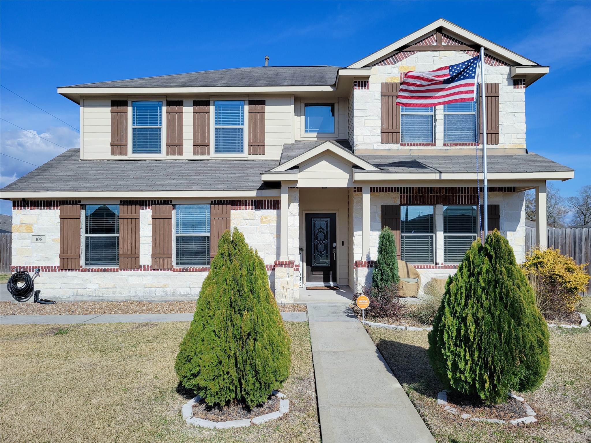 108 Sam Drive Dayton, TX 77535 - Photo 1 of 38 a front view of a house with a garden