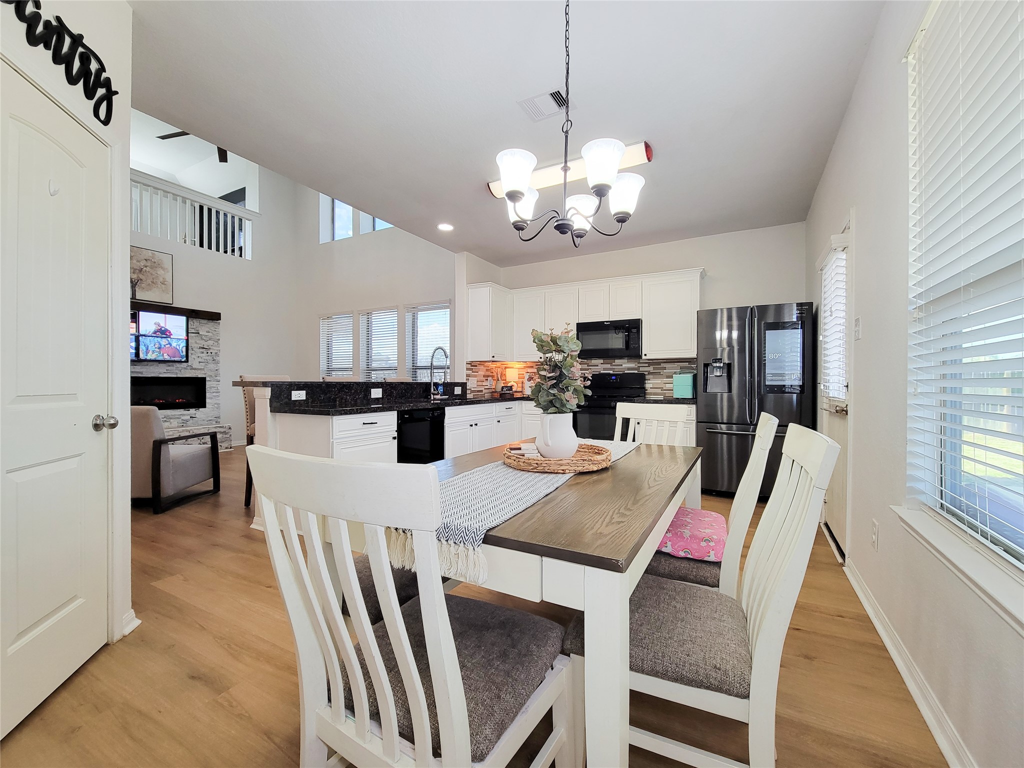 108 Sam Drive Dayton, TX 77535 - Photo 13 of 38 a view of a dining room with furniture and a chandelier