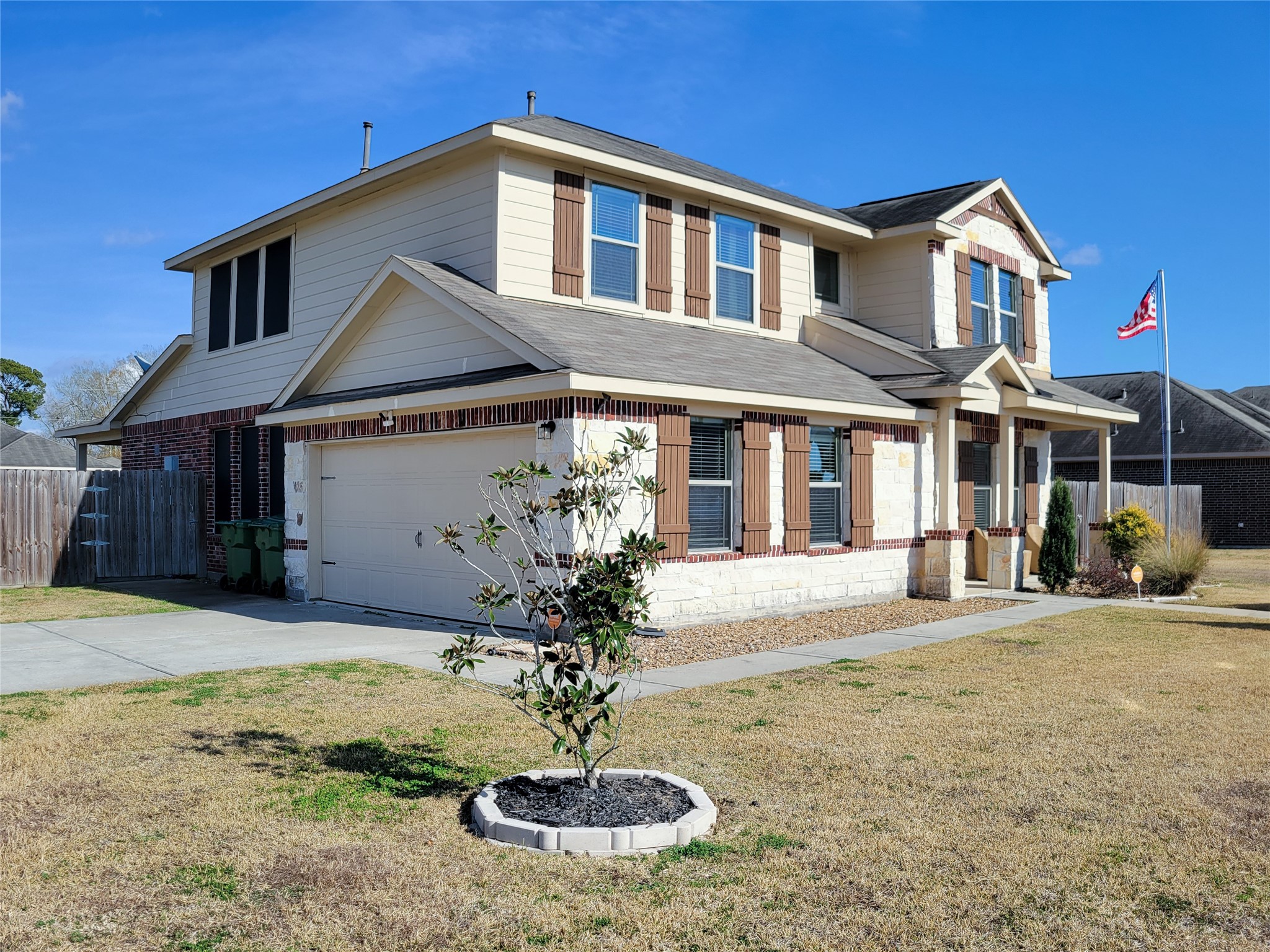 108 Sam Drive Dayton, TX 77535 - Photo 2 of 38 a front view of a house with garden