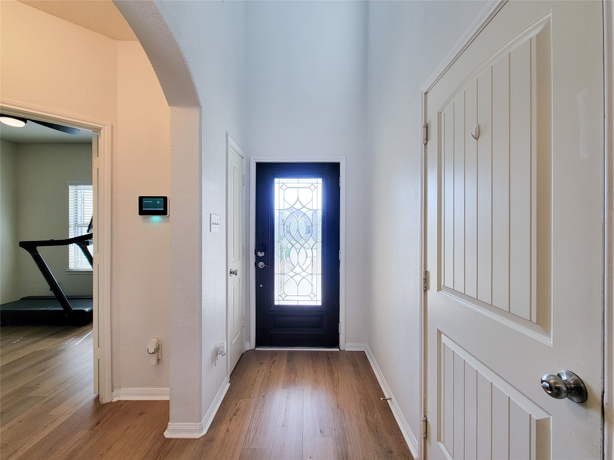 108 Sam Drive Dayton, TX 77535 - Photo 22 of 38 a view of a hallway with wooden floor and stairs