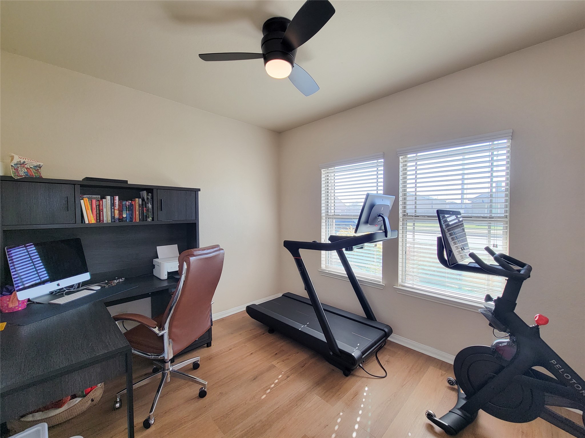 108 Sam Drive Dayton, TX 77535 - Photo 23 of 38 a view of a workspace with furniture and a window