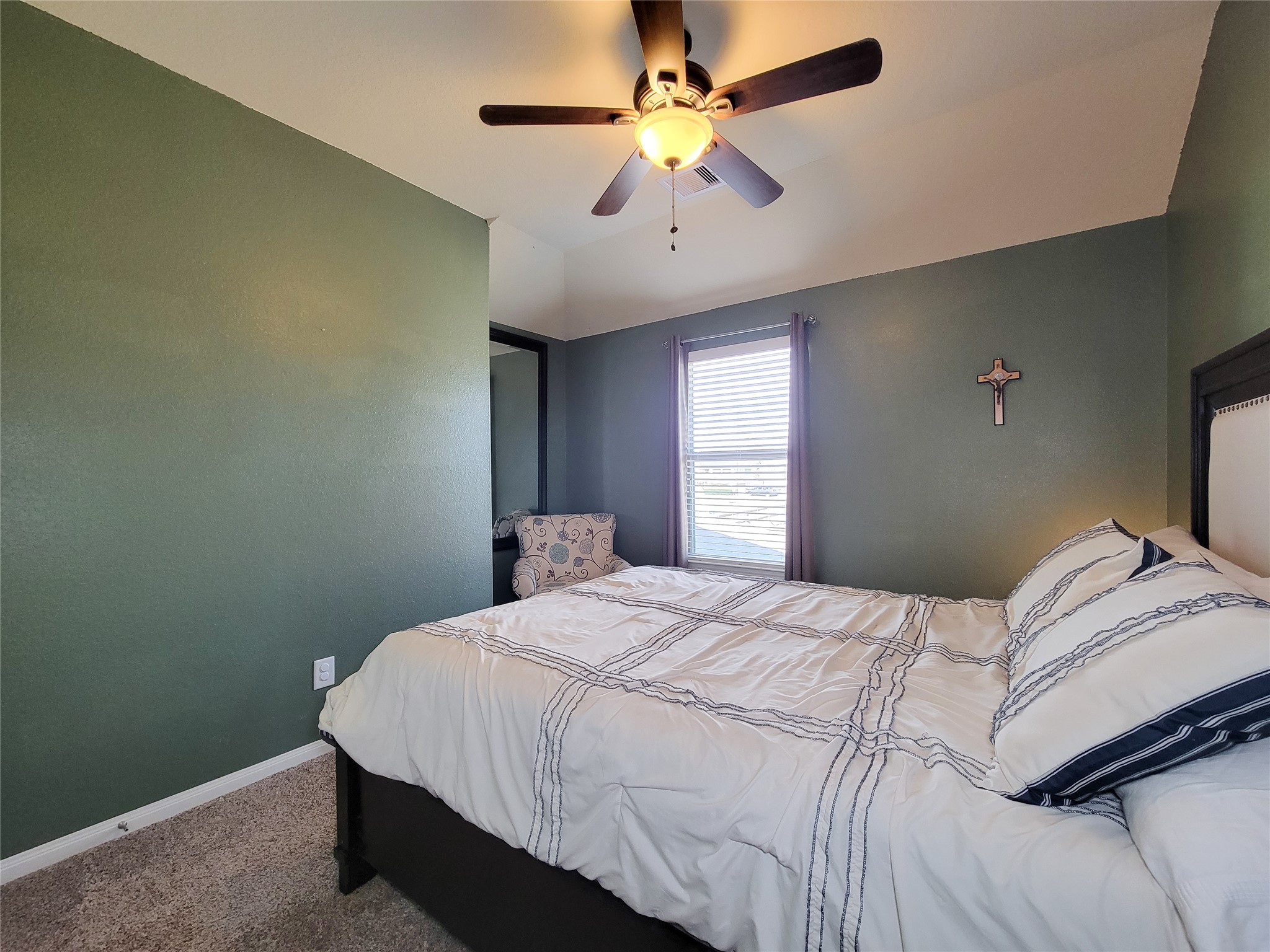 108 Sam Drive Dayton, TX 77535 - Photo 30 of 38 a bedroom with a bed and a ceiling fan