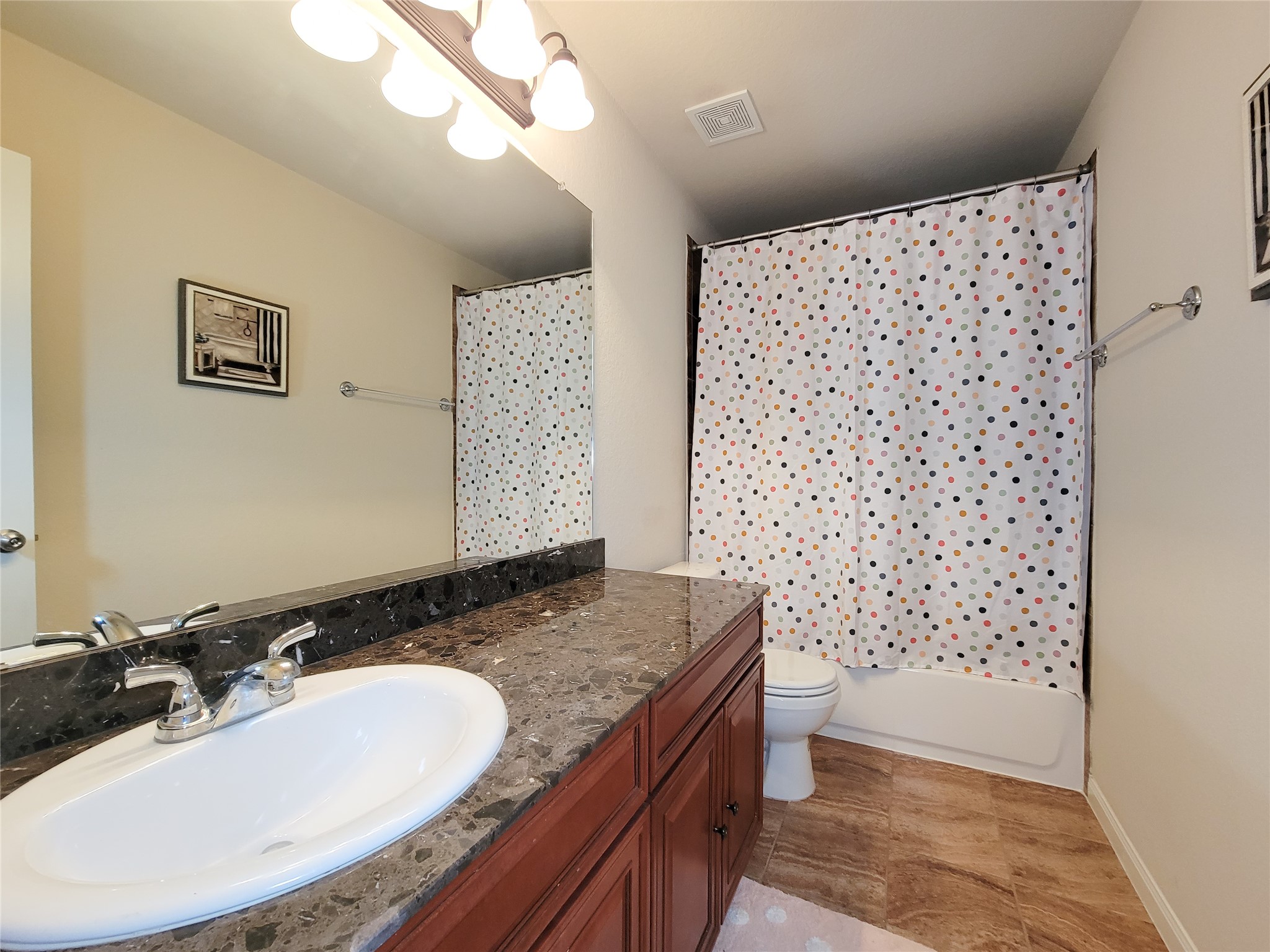 108 Sam Drive Dayton, TX 77535 - Photo 31 of 38 a bathroom with a granite countertop sink toilet and shower
