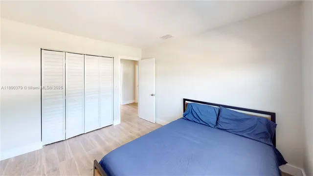 a view of an empty room and wooden floor