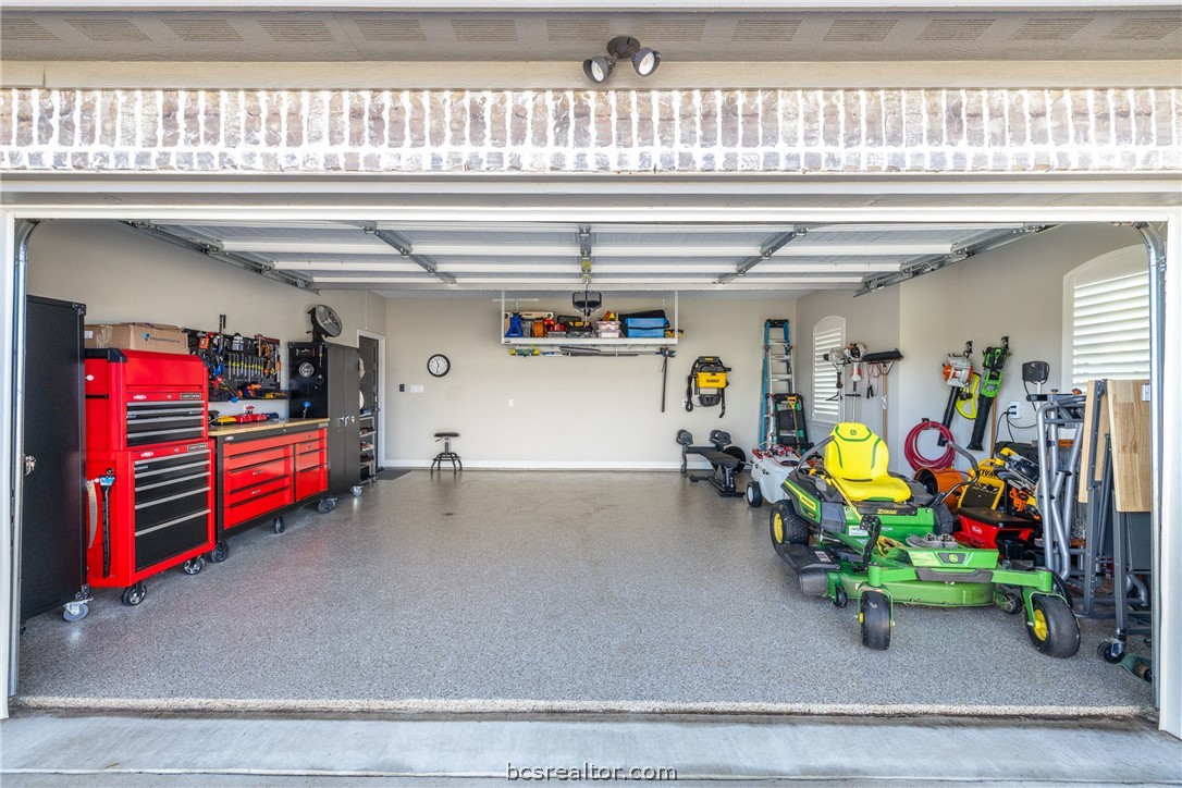 3222 Hunters Crossing Bryan, TX 77808 - Photo 37 of 44 Garage with built in shelving and wall mounted racks.