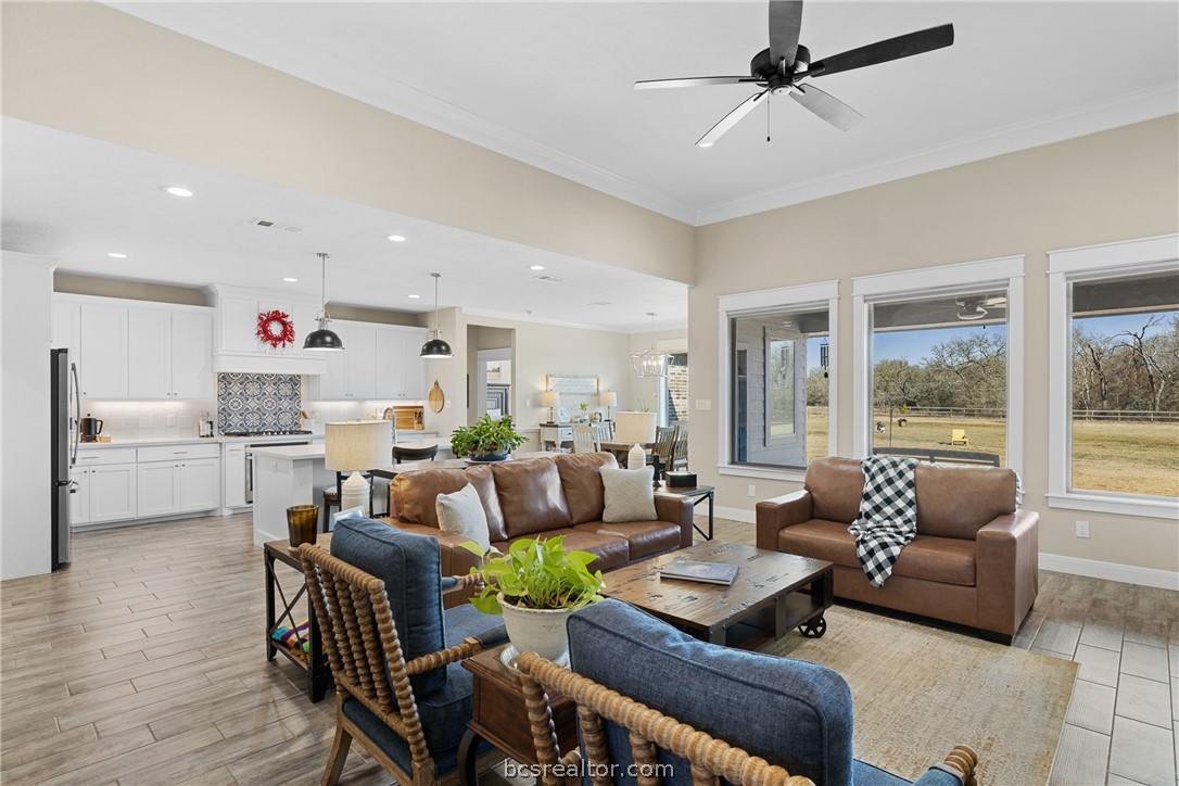 3222 Hunters Crossing Bryan, TX 77808 - Photo 10 of 44 Living room featuring crown molding, light wood-type flooring, ceiling fan, and recessed lighting
