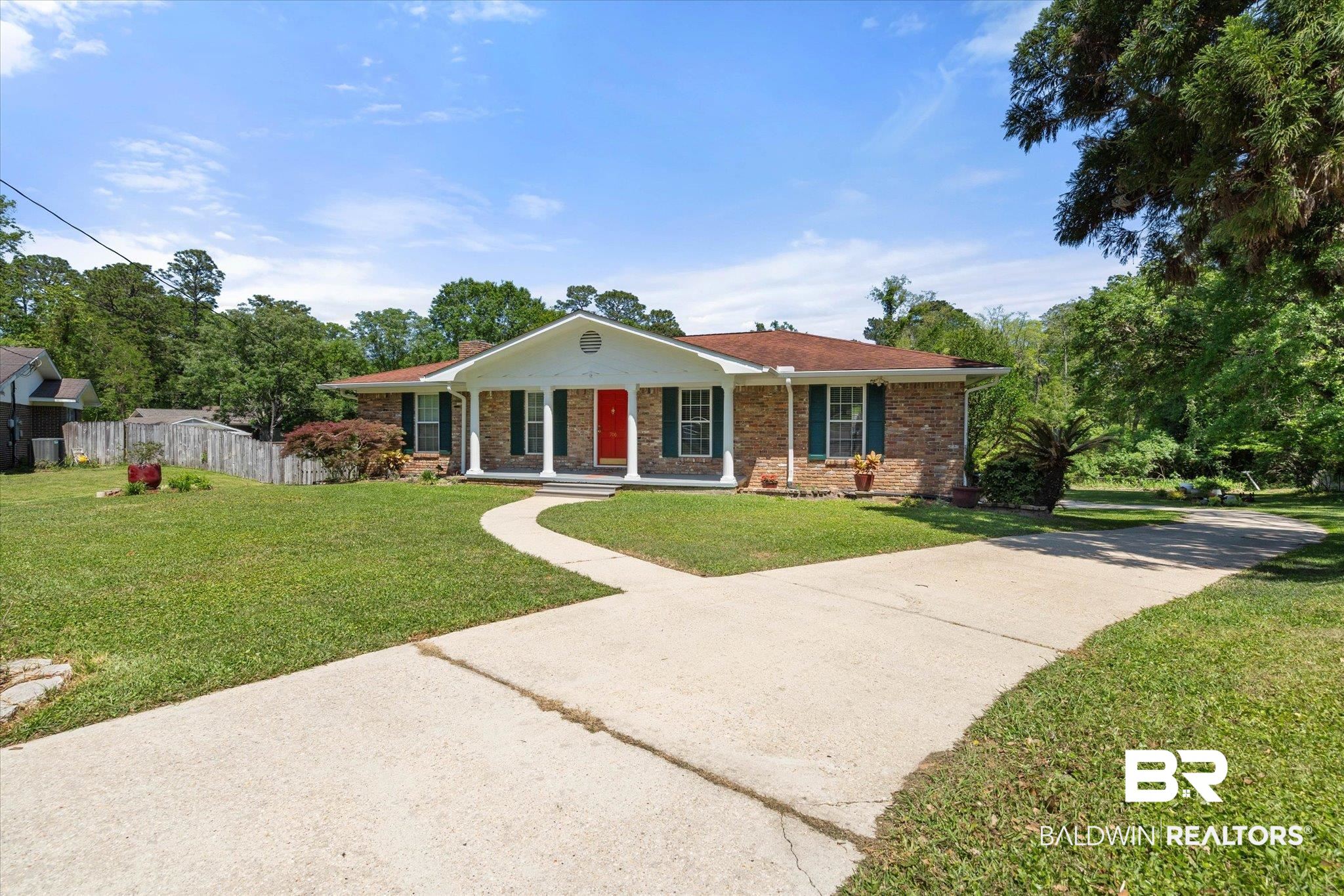 706 Sutherland Drive Chickasaw, AL 36611 - Photo 30 of 33 Single story home featuring a chimney, fence, covered porch, brick siding, and a front yard