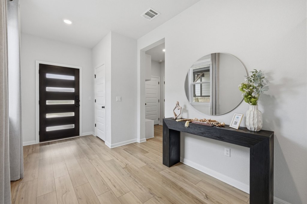 8001 Andravida Drive Austin, TX 78747 - Photo 8 of 35 Welcoming entryway with fresh, neutral design