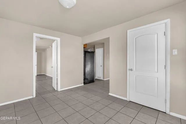 an empty room with closet area