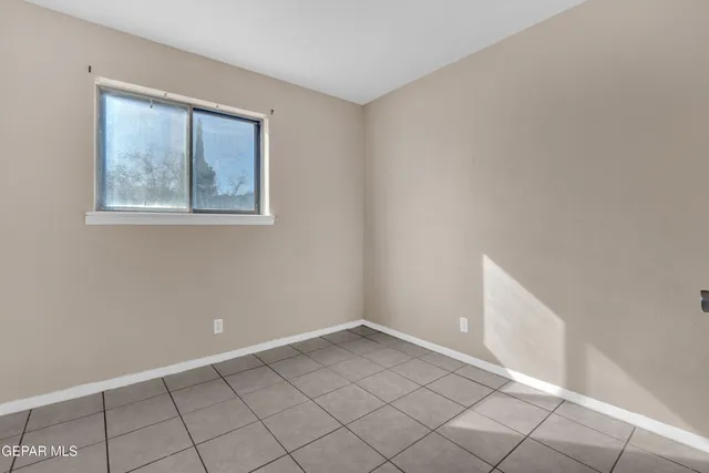 a view of an empty room with windows