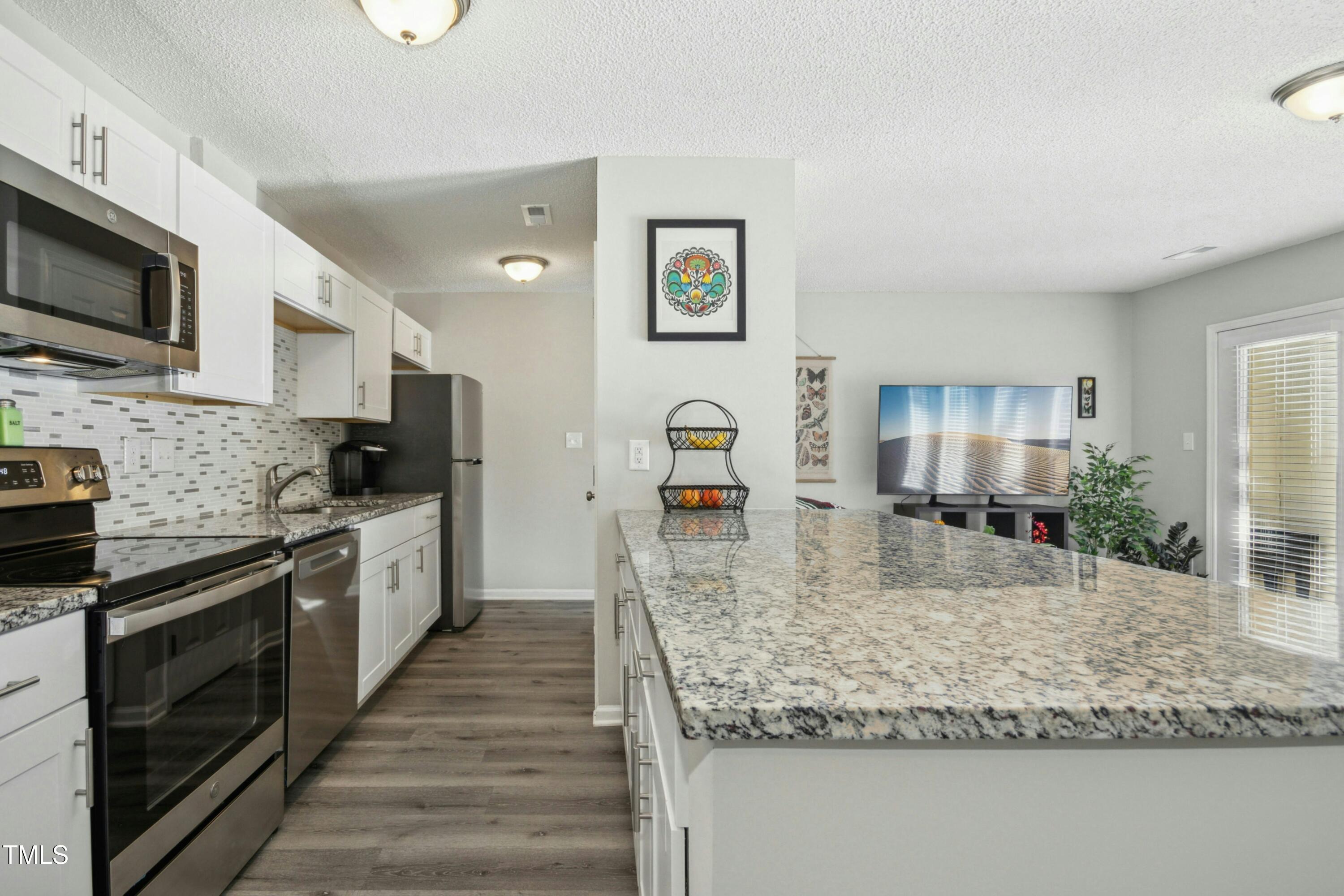 2011 Quaker Landing, Unit 104 Raleigh, NC 27603 - Photo 6 of 26 013-477386-IMG_2333