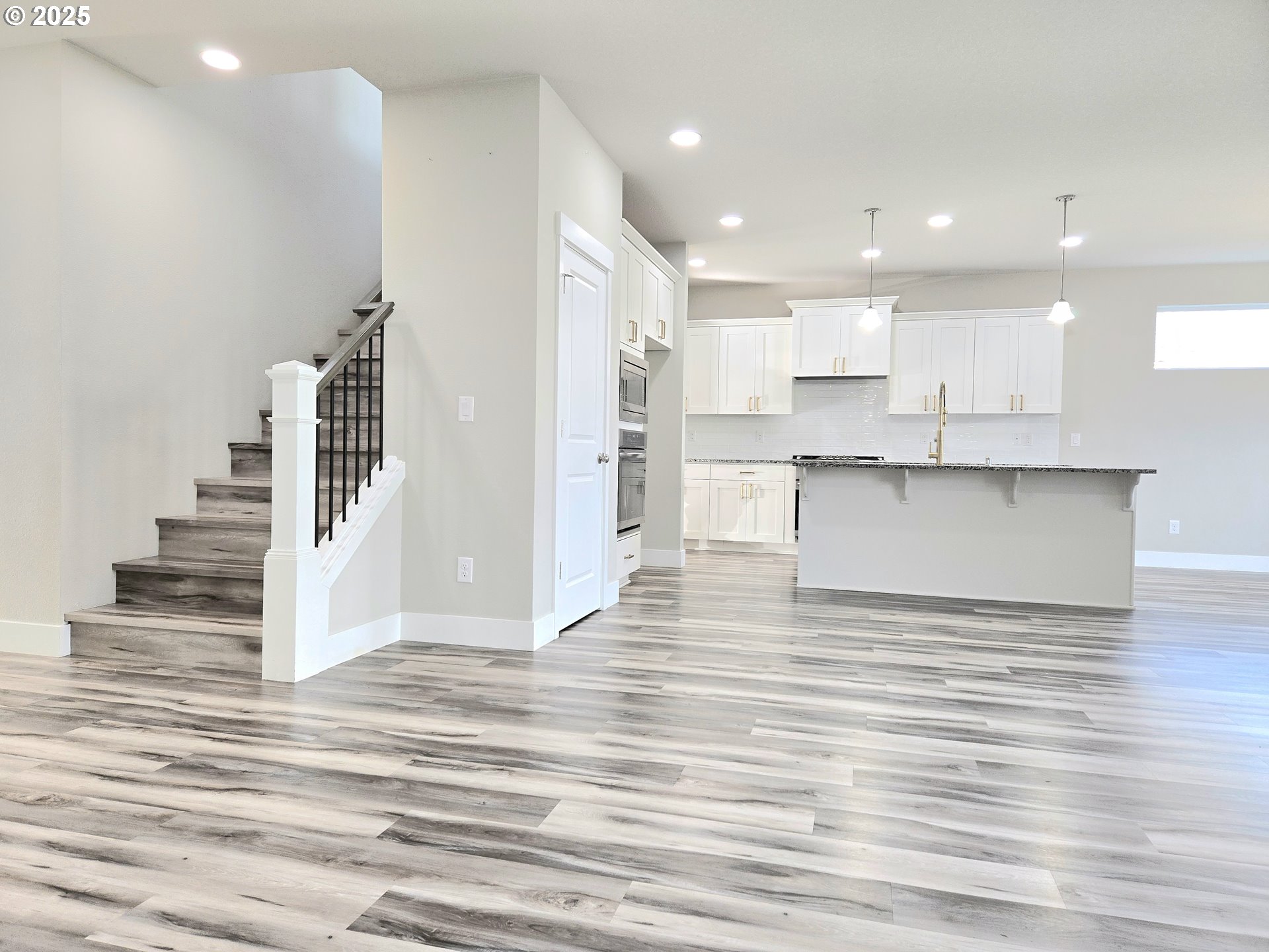 8524 North 1st Street Ridgefield, WA 98642 - Photo 11 of 48 a view of kitchen and wooden floor