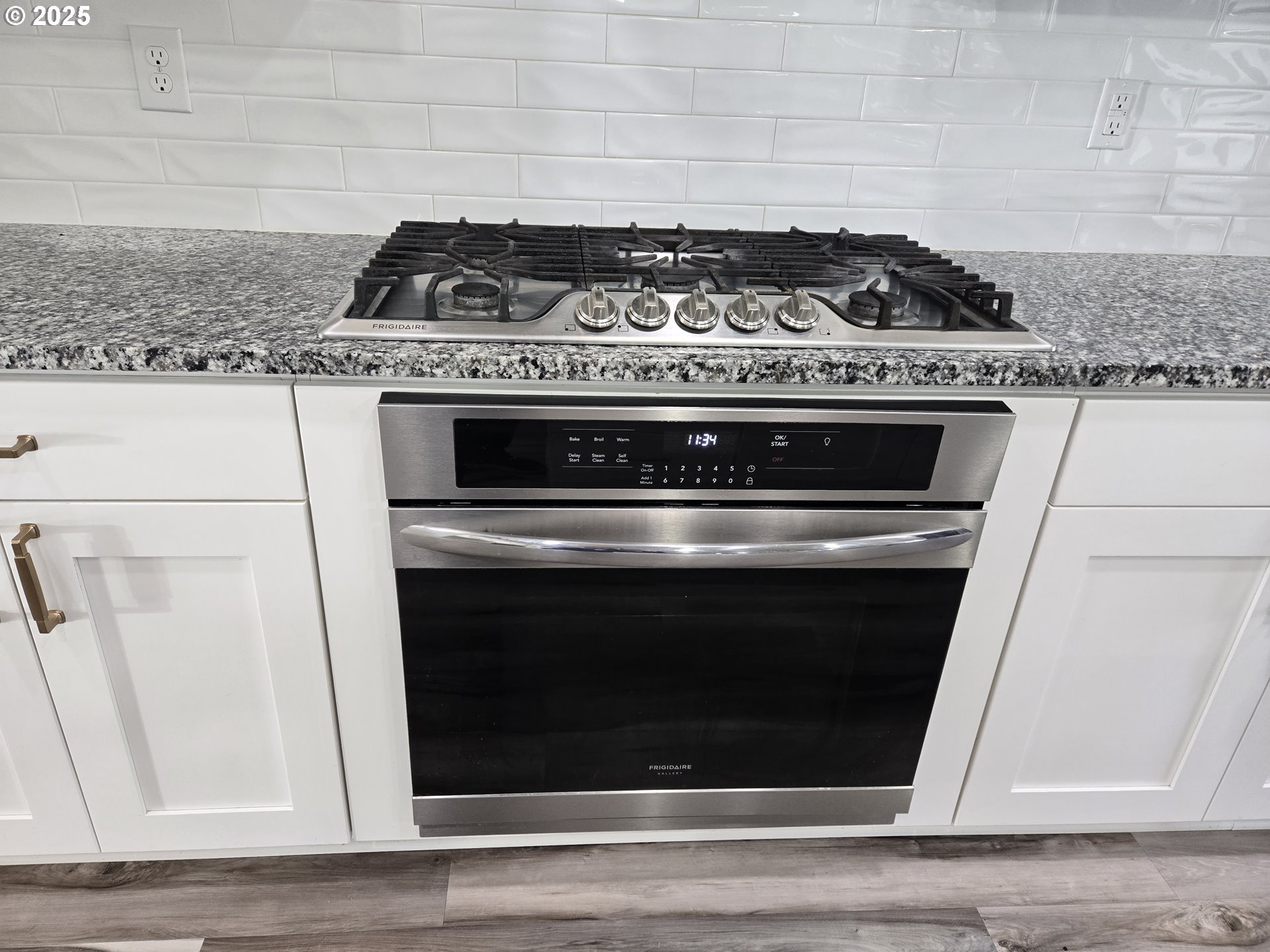 8524 North 1st Street Ridgefield, WA 98642 - Photo 16 of 48 a stove top oven sitting inside of a kitchen