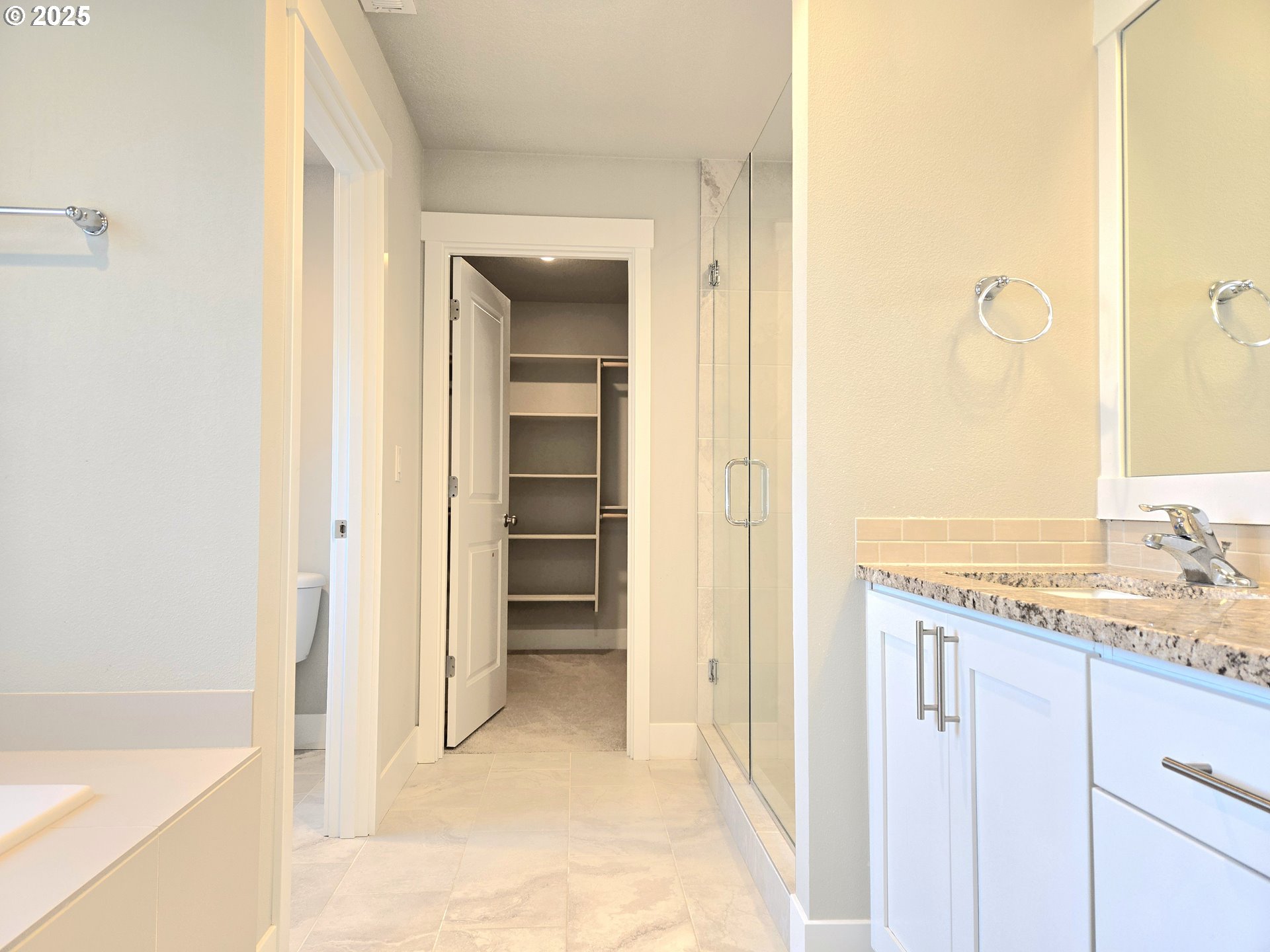 8524 North 1st Street Ridgefield, WA 98642 - Photo 26 of 48 a view of a bathroom with a granite countertop sink