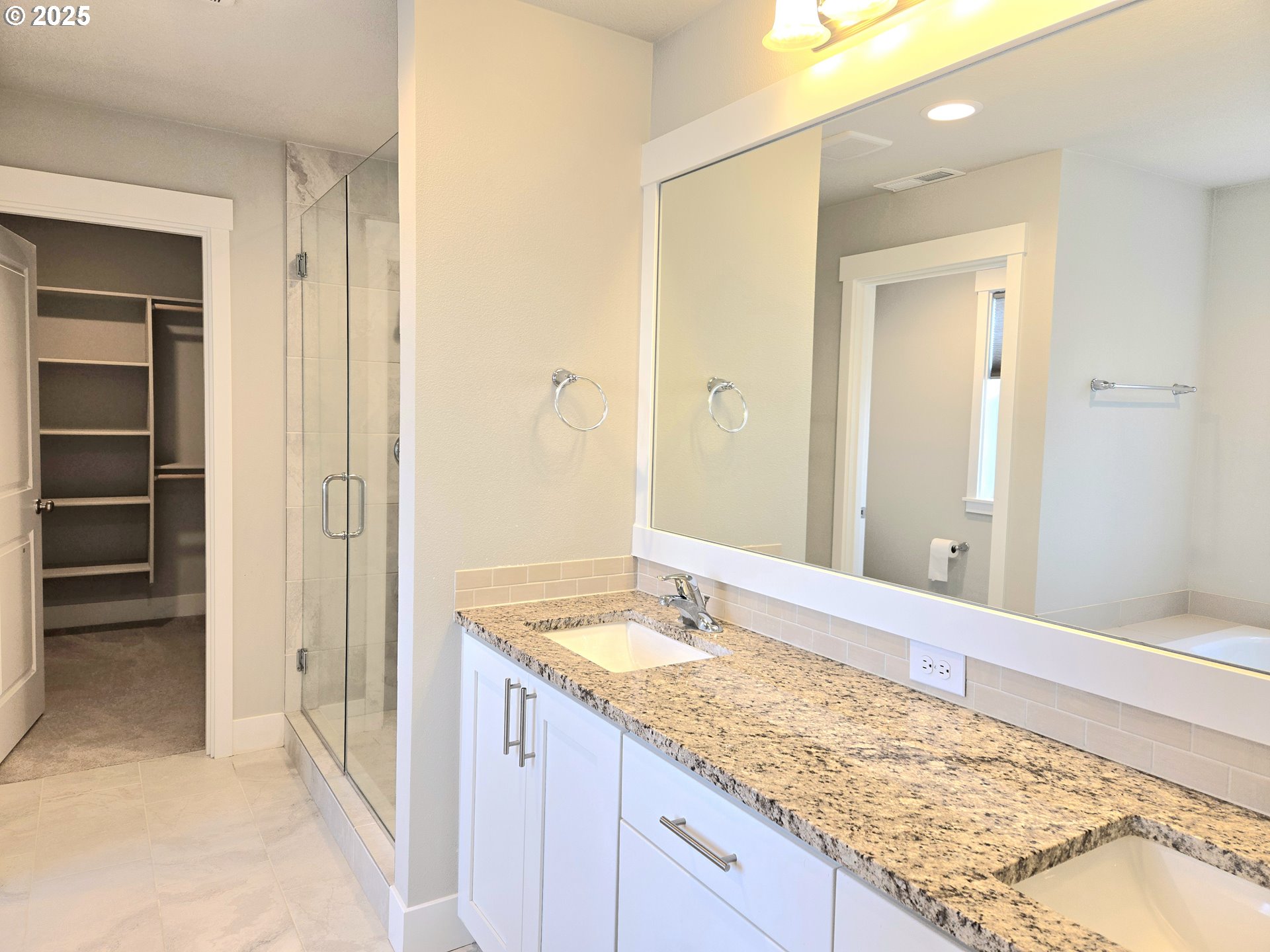 8524 North 1st Street Ridgefield, WA 98642 - Photo 28 of 48 a bathroom with a granite countertop sink and a mirror