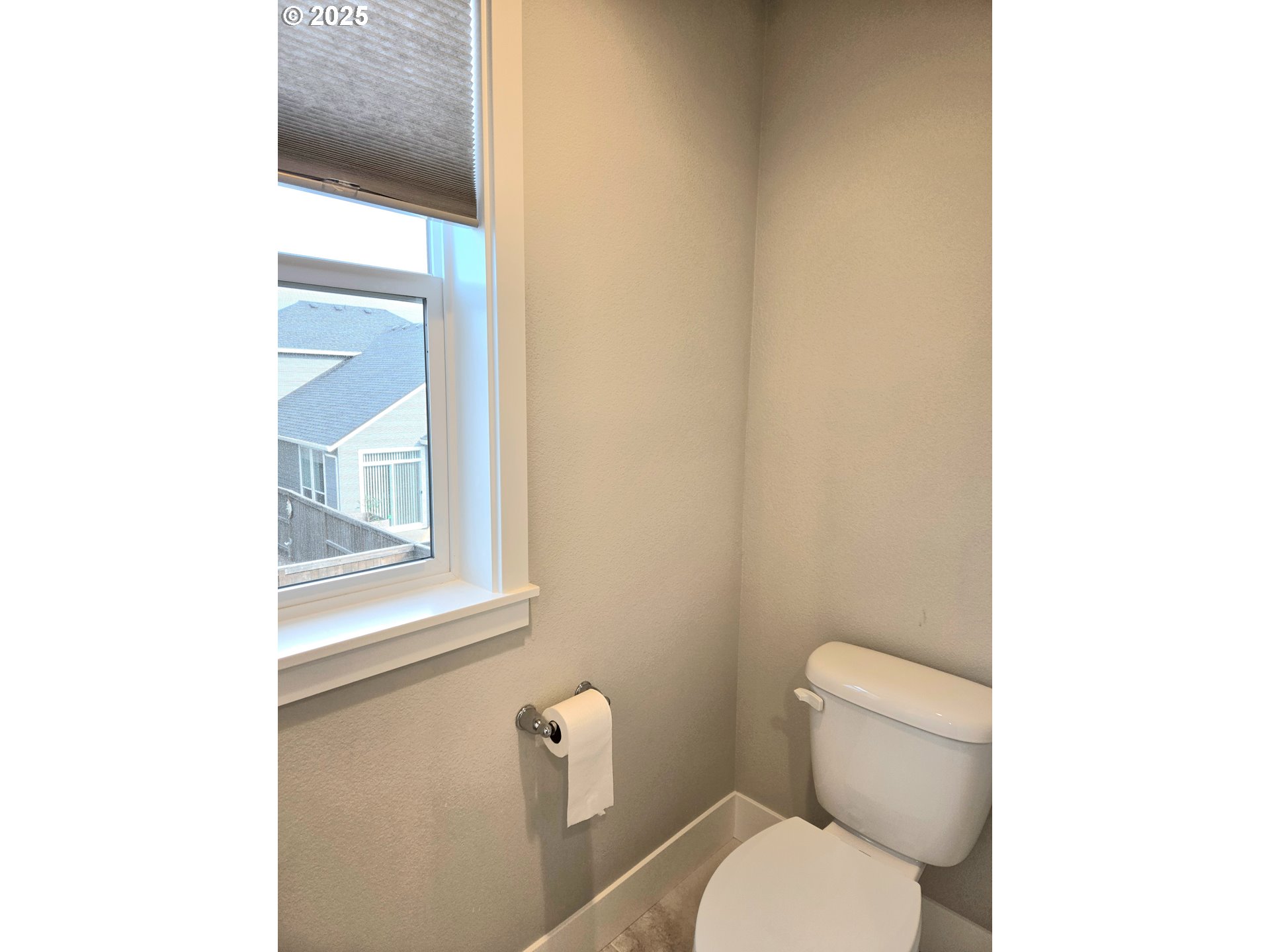 8524 North 1st Street Ridgefield, WA 98642 - Photo 30 of 48 a white toilet sitting next to a bathroom sink