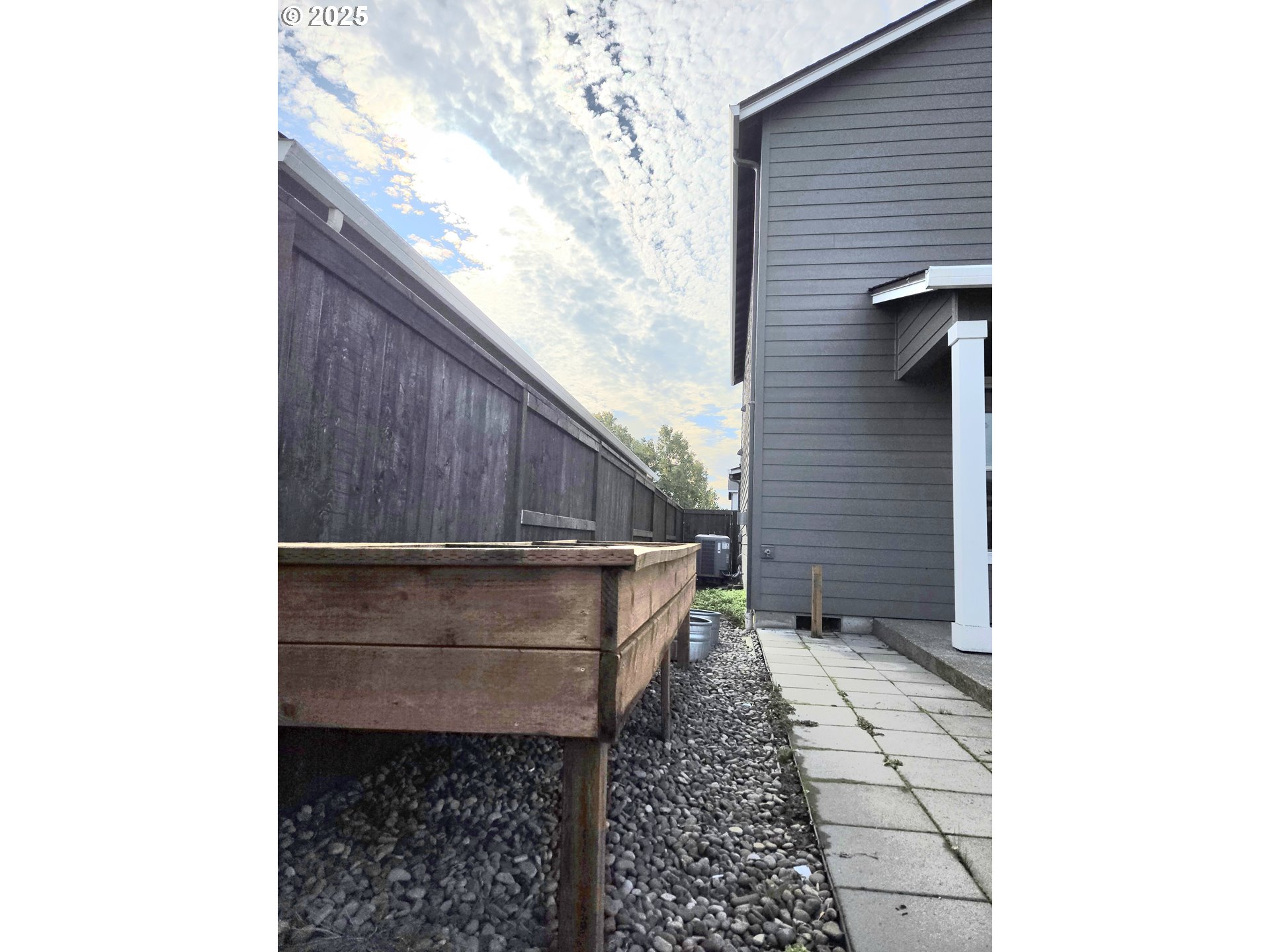 8524 North 1st Street Ridgefield, WA 98642 - Photo 44 of 48 a pathway of a house with a small yard and wooden fence