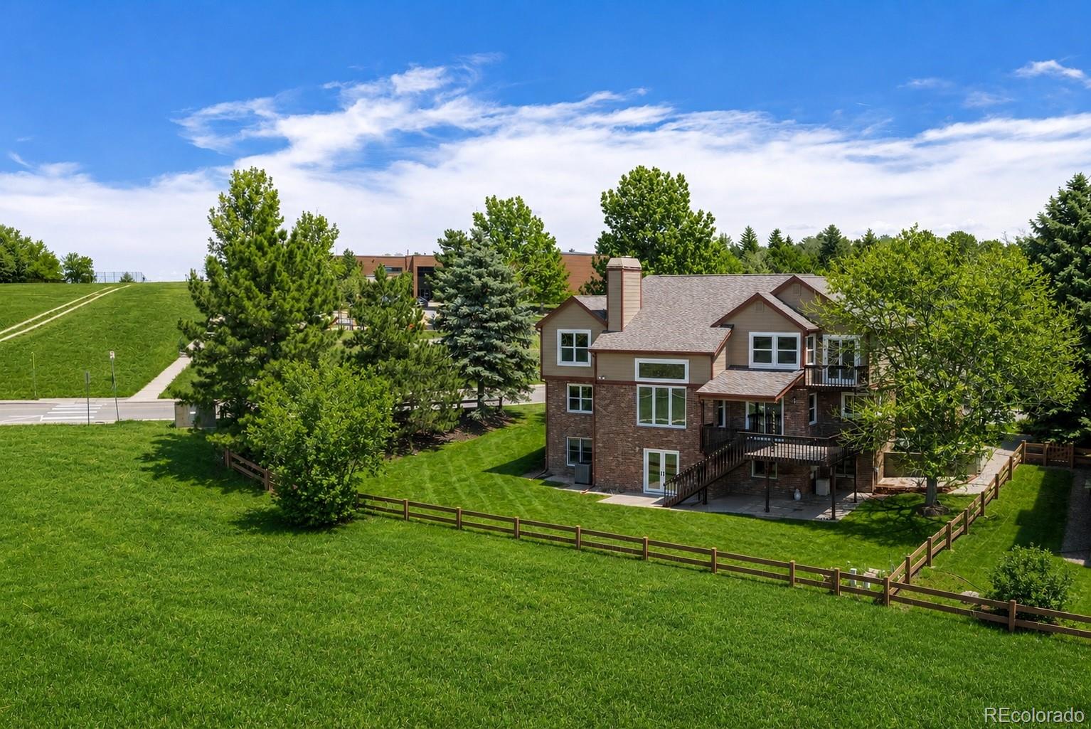 1914 Terrace Drive Highlands Ranch, CO 80126 - Photo 43 of 47 a aerial view of a house with a big yard