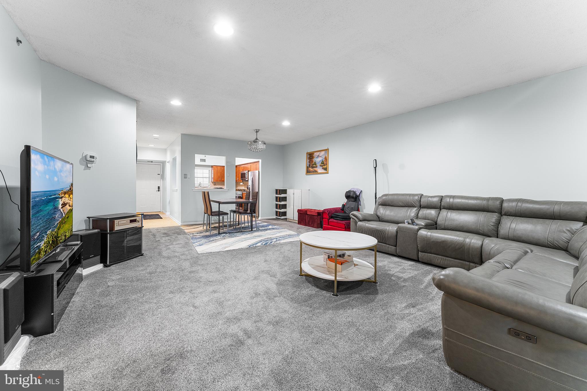 6070 Main Street Voorhees, NJ 08043 - Photo 1 of 22 a living room with furniture and a flat screen tv