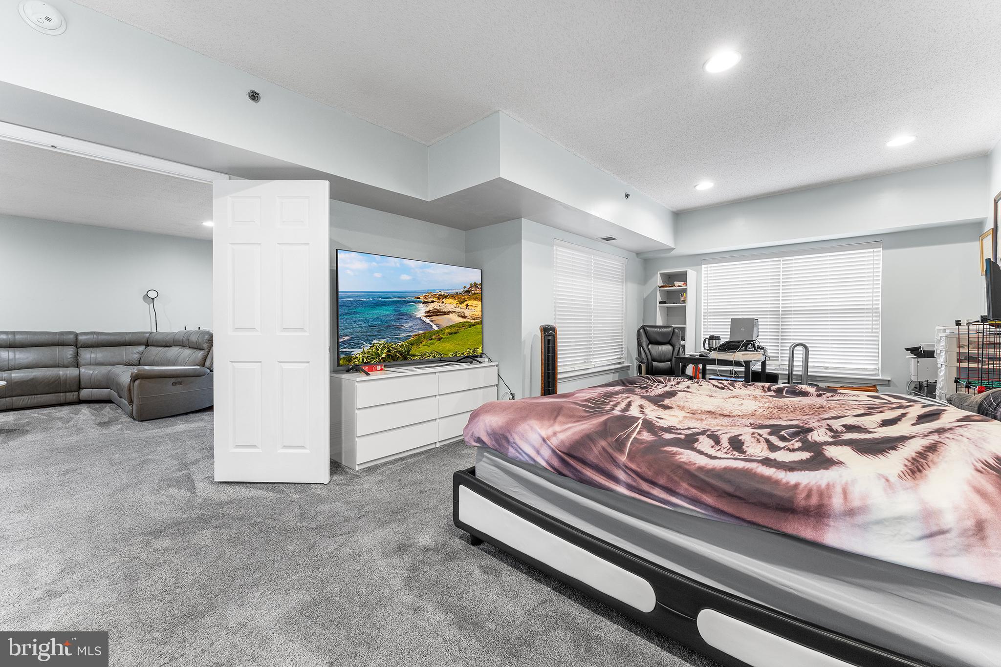 6070 Main Street Voorhees, NJ 08043 - Photo 13 of 22 a bed room with furniture and a flat screen tv