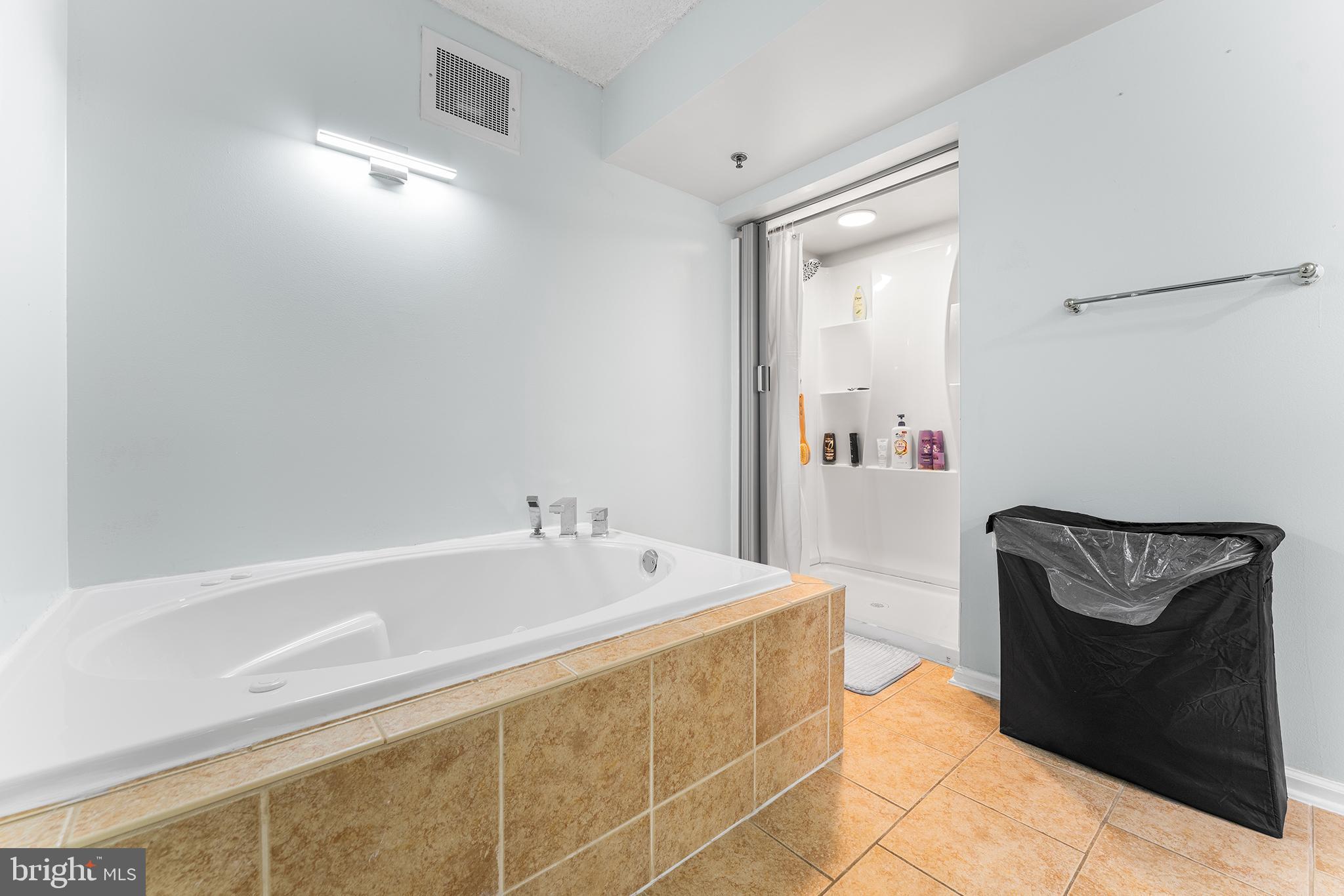 6070 Main Street Voorhees, NJ 08043 - Photo 16 of 22 a bathroom with a sink and a mirror