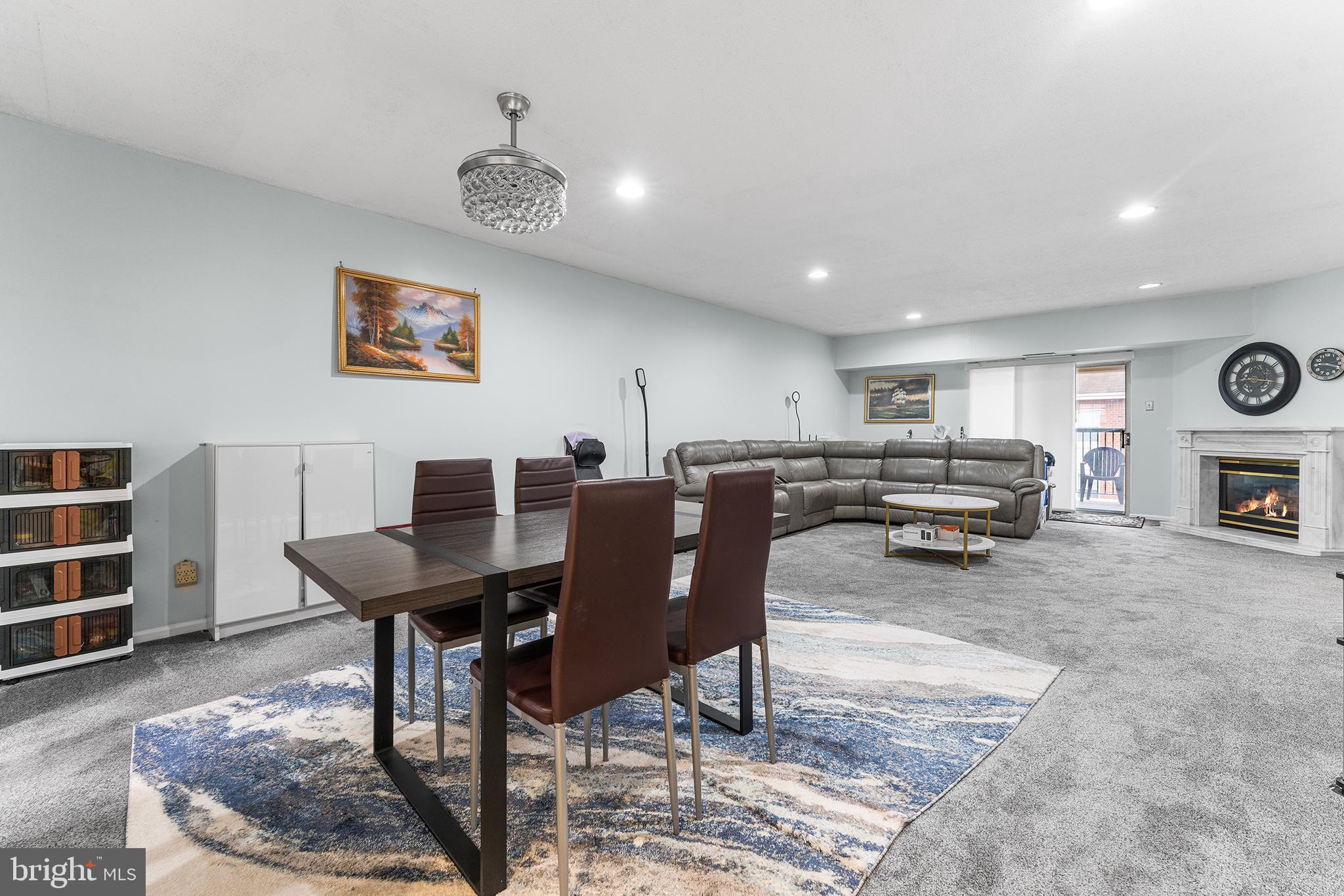 6070 Main Street Voorhees, NJ 08043 - Photo 2 of 22 a living room with furniture a rug and kitchen view
