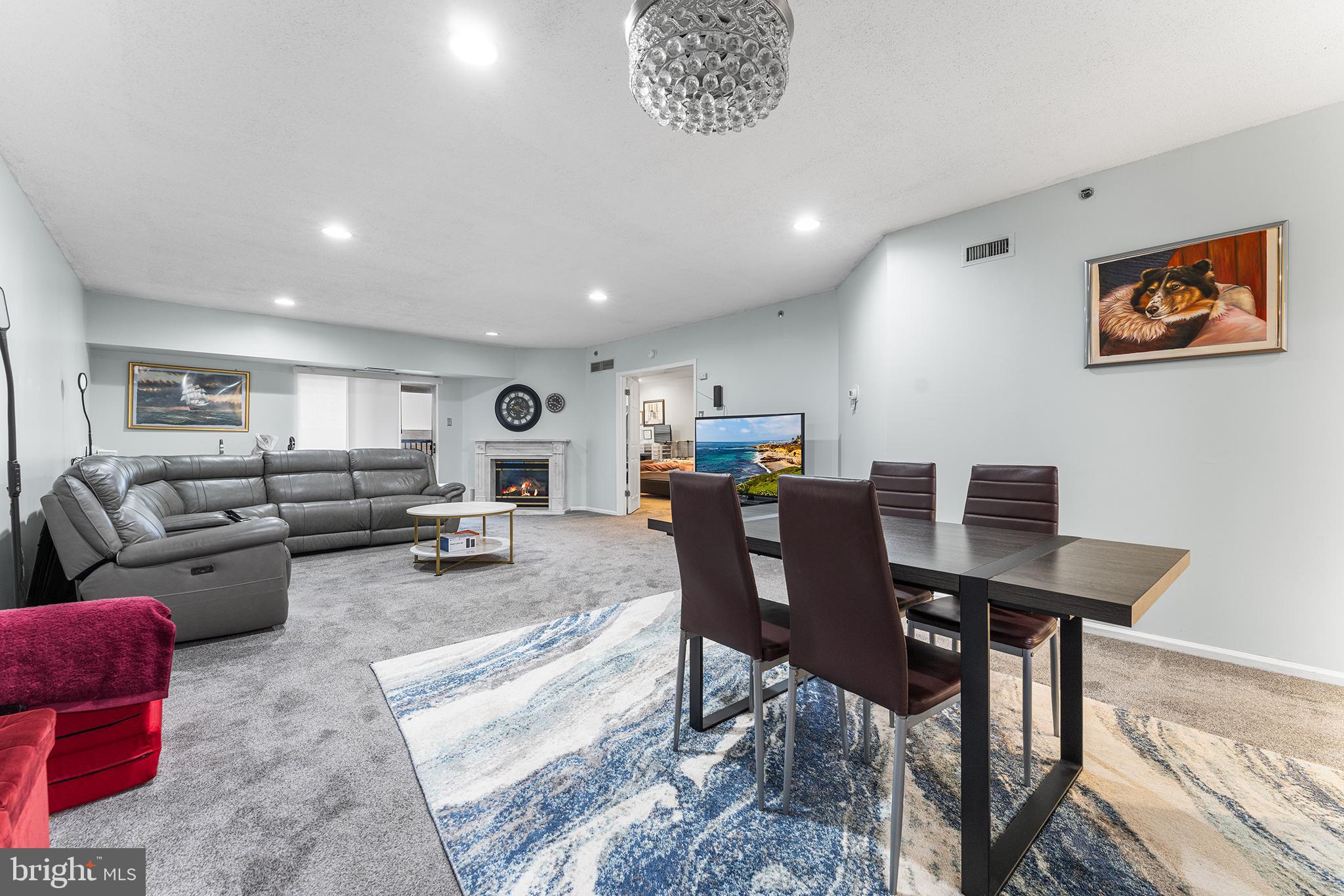6070 Main Street Voorhees, NJ 08043 - Photo 3 of 22 a living room with furniture a dining table and chairs
