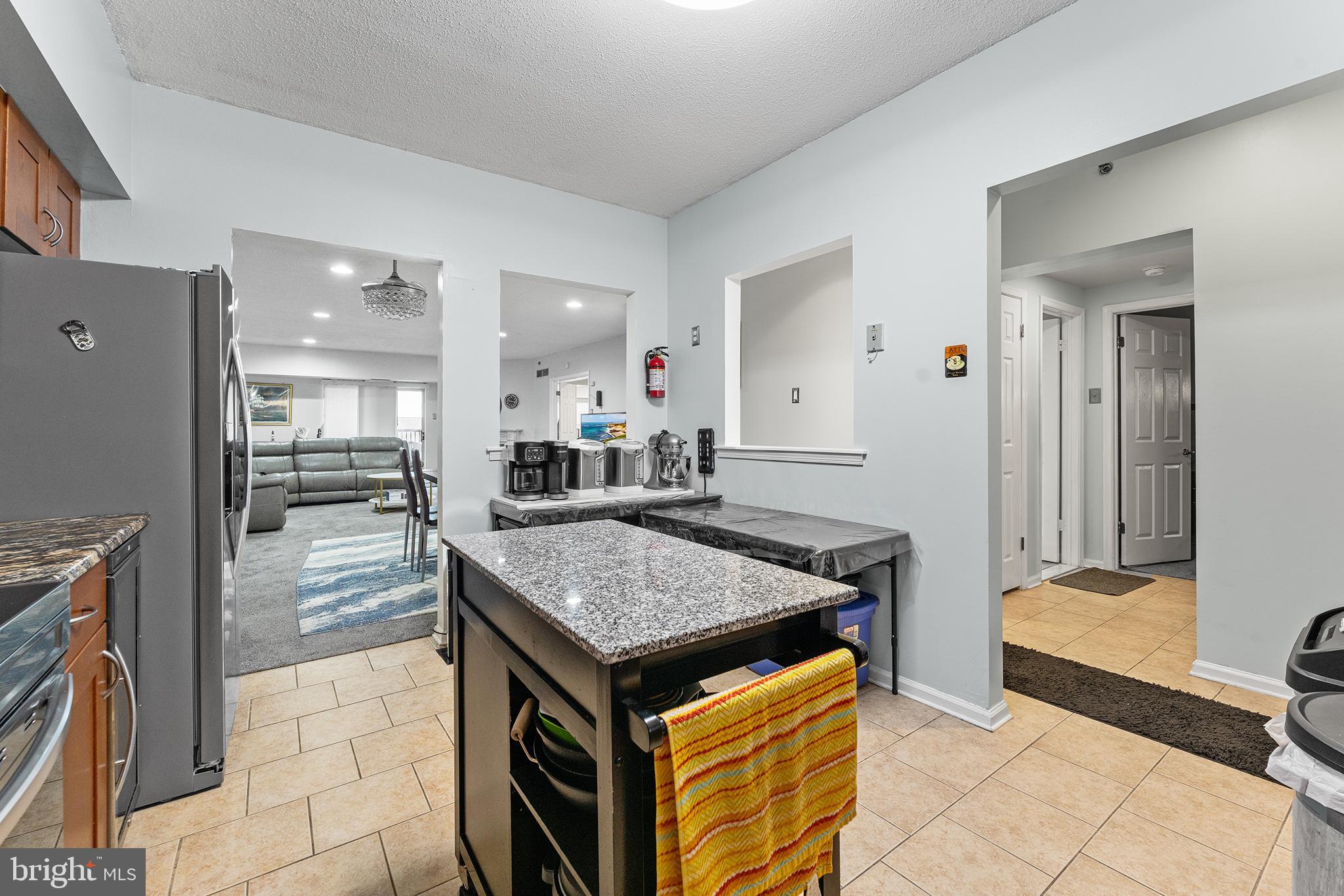 6070 Main Street Voorhees, NJ 08043 - Photo 7 of 22 a kitchen with a table and chairs in it