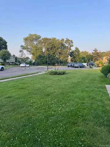 a view of a golf course with a lake