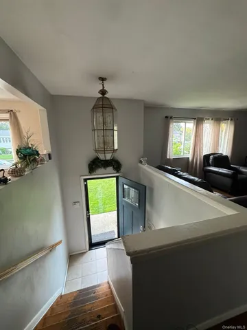 a view of a kitchen from a hallway