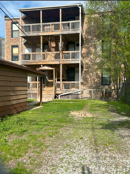 4622 South Indiana Avenue Chicago, IL 60653 - Photo 12 of 13 a view of a house with a yard