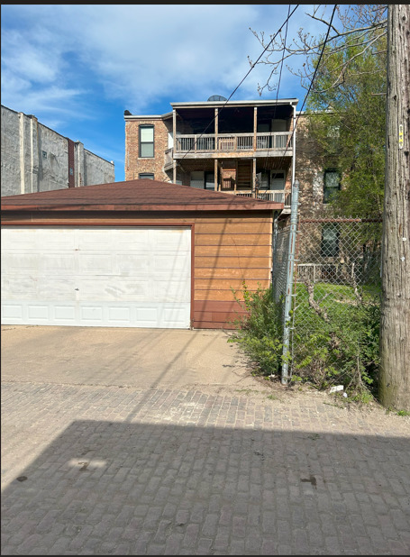 4622 South Indiana Avenue Chicago, IL 60653 - Photo 13 of 13 a front view of a house with a yard and garage