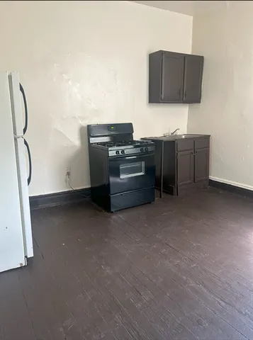 a kitchen with stainless steel appliances a stove and a refrigerator