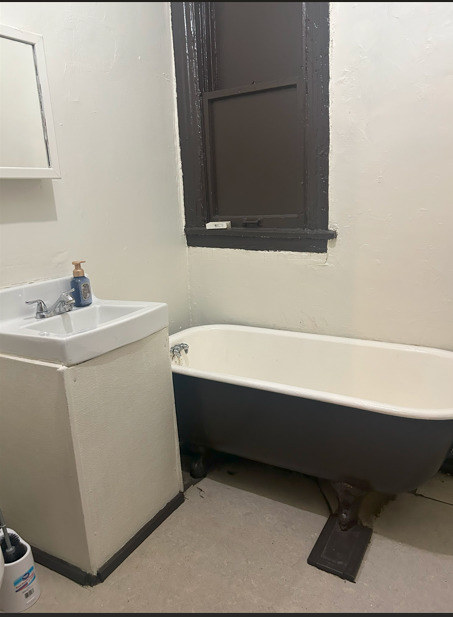 4622 South Indiana Avenue Chicago, IL 60653 - Photo 9 of 13 a bathroom with a sink toilet and mirror