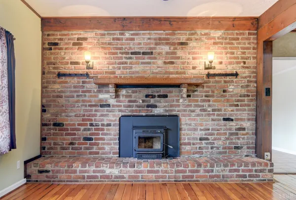 a view of open kitchen with granite countertop a stove top oven