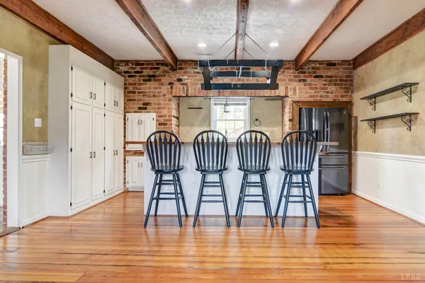 a view of kitchen and dining room with wooden floor