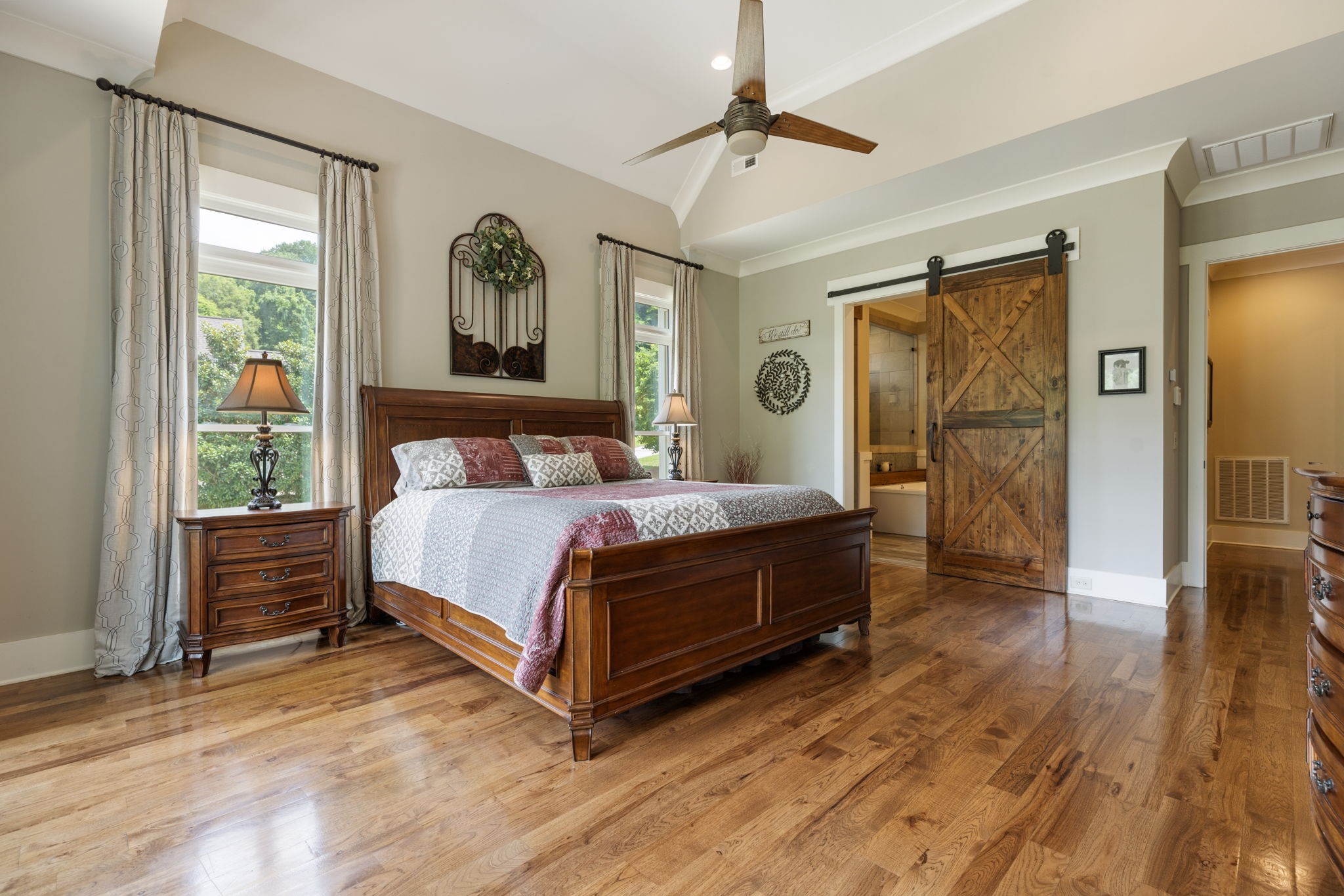 641 Legends Crest Drive Franklin, TN 37069 - Photo 28 of 99 a bedroom with a bed and a chandelier