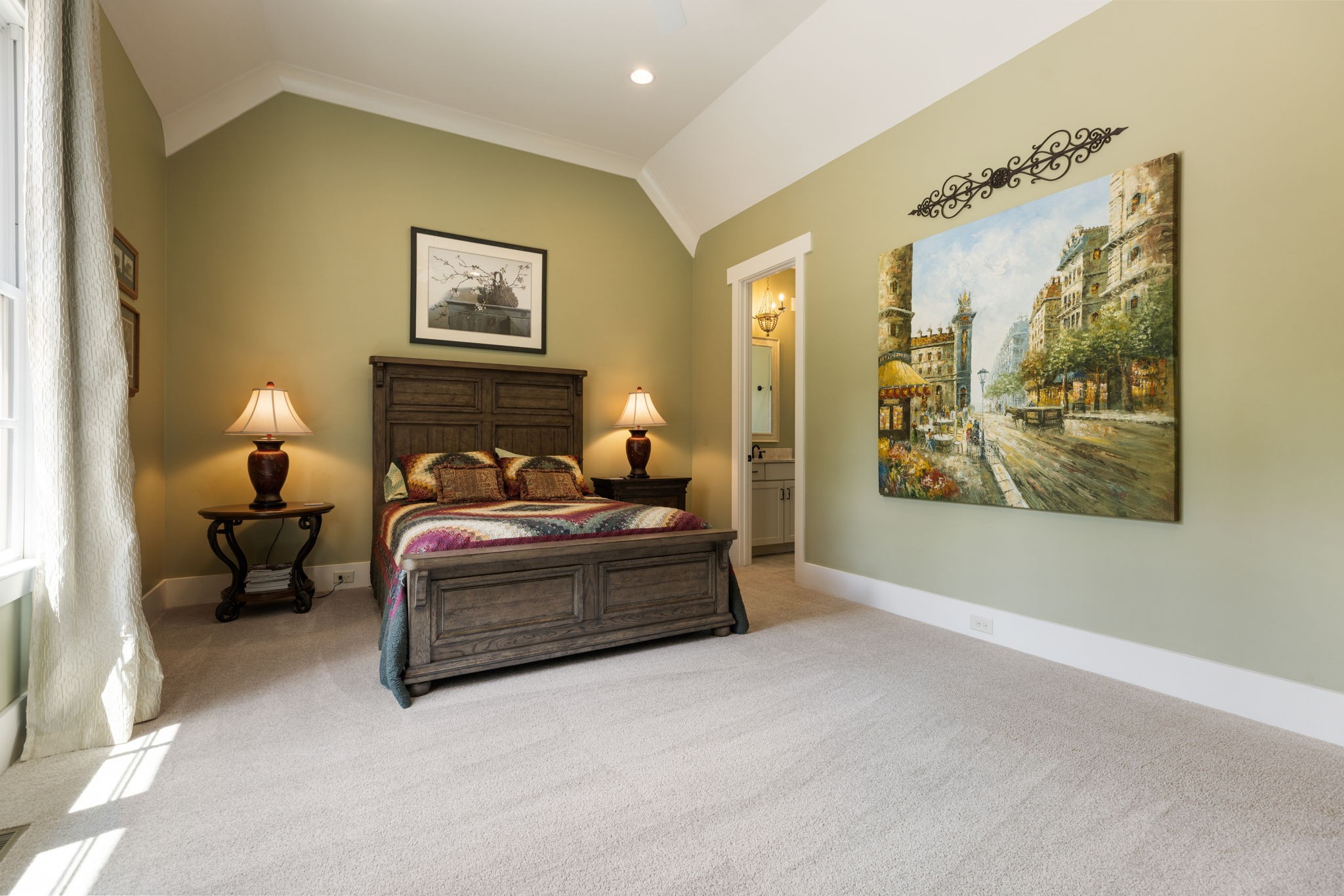 641 Legends Crest Drive Franklin, TN 37069 - Photo 41 of 99 a spacious bedroom with a bed and wall painting