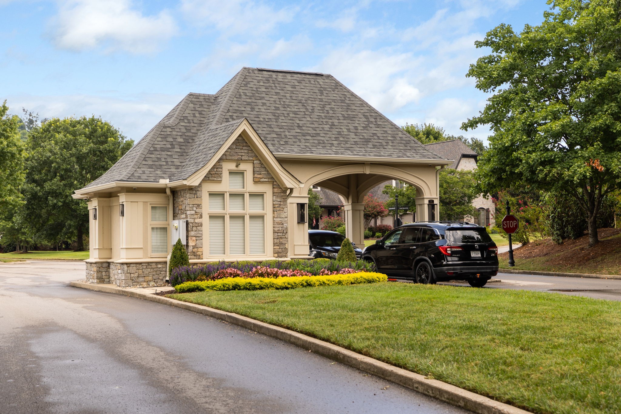 641 Legends Crest Drive Franklin, TN 37069 - Photo 91 of 99 a car parked in front of a house with a small yard
