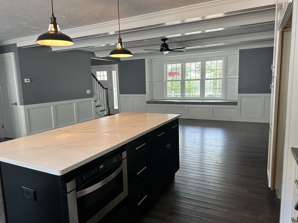 242 East County Road Rutland, MA 01543 - Photo 13 of 35 a kitchen with a wooden floor and a refrigerator