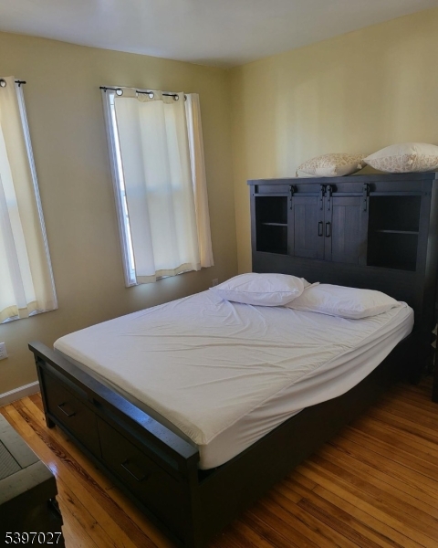 1371 Clinton Avenue Irvington, NJ 07111 - Photo 12 of 41 a bedroom with a bed and a window
