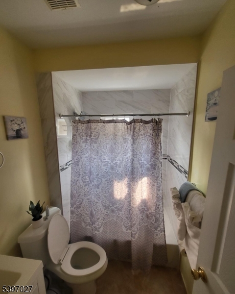 1371 Clinton Avenue Irvington, NJ 07111 - Photo 17 of 41 a bathroom with a toilet and a shower