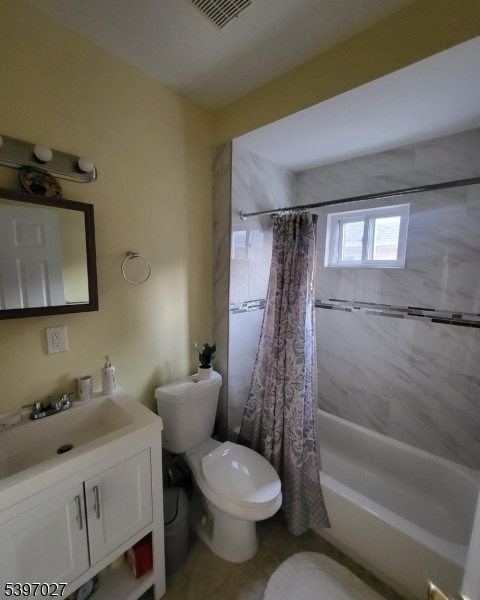 1371 Clinton Avenue Irvington, NJ 07111 - Photo 19 of 41 a bathroom with a toilet sink and shower