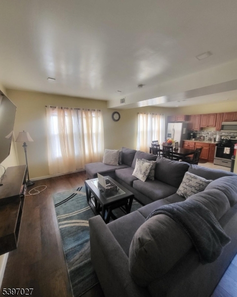 1371 Clinton Avenue Irvington, NJ 07111 - Photo 23 of 41 a living room with furniture and a lamp