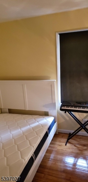 1371 Clinton Avenue Irvington, NJ 07111 - Photo 26 of 41 a room with a bed